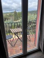 a view from a window with a table and a bench at Chambres d&#39;hôtes Le Montagné in Villeneuve-lès-Avignon