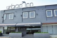Un edificio con un cartel en el frente. en Urban Inn Kulim, en Kulim