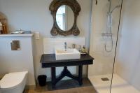 a bathroom with a sink and a shower at Kermaria Studio Suite in Pont-Aven