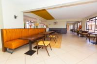 a dining room with tables and chairs in a restaurant at Southgate Residence Serviced Apartments in Nairobi