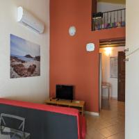 Televízia a/alebo spoločenská miestnosť v ubytovaní Casa Vacanza Tortolì Plus VIII e IX