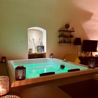 a hot tub in a living room with at Muralta Suite &amp; Luxury Rooms in Altamura