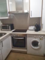 Kuchyň nebo kuchyňský kout v ubytování Apartamento en urbanización con piscina en Playa de Silgar