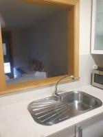 Kuchyň nebo kuchyňský kout v ubytování Apartamento en urbanización con piscina en Playa de Silgar