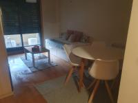 Posezení v ubytování Apartamento en urbanización con piscina en Playa de Silgar