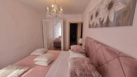 Postel nebo postele na pokoji v ubytování Apartment Vestibul Inn