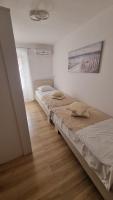 Postel nebo postele na pokoji v ubytování Apartment Vestibul Inn