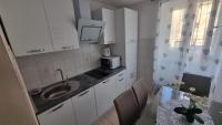 Kuchyň nebo kuchyňský kout v ubytování Apartment Vestibul Inn