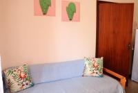 A bed or beds in a room at Comfy flat just 80m from the beach
