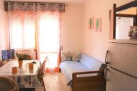 A seating area at Comfy flat just 80m from the beach