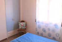 A bed or beds in a room at Comfy flat just 80m from the beach