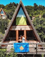 two people are standing in a play house at Villa Kalaja in Novoberdo