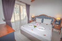 A bed or beds in a room at Likya Labis 2+1 Villa, Özel Havuzlu, Fethiye