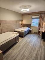 Postel nebo postele na pokoji v ubytování Hotell Stinsen