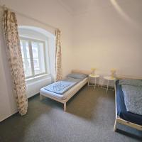 Postel nebo postele na pokoji v ubytování Zámek Ruda nad Moravou