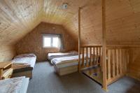 Posteľ alebo postele v izbe v ubytovaní Chaty - Resort AQUA MARIA