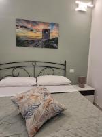 Posteľ alebo postele v izbe v ubytovaní JEY STUDIO_INDEPENDENT SEAFRONT APARTMENT