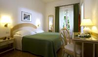 Postel nebo postele na pokoji v ubytování Hotel Villa Angelica