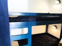 Łóżko lub łóżka w pokoju w obiekcie Résidence Le Boucanier - Studio pour 4 Personnes 144