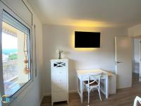 Televízia a/alebo spoločenská miestnosť v ubytovaní Apartamento Bluedream by Rent Costa Brava