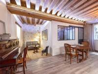 Televízia a/alebo spoločenská miestnosť v ubytovaní L'atelier des Traboules, au cœur du Vieux Lyon AIL