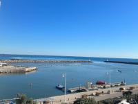 a view of a harbor with boats in the water at Superbe Appartement Vue Mer T3 70m2 in Mauguio