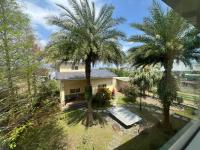 an aerial view of a house with two palm trees at Annongriver B&amp;B in Sanxing