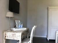Televízia a/alebo spoločenská miestnosť v ubytovaní Skipper White Guest House