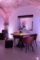 a dining room with a wooden table and chairs at Moliké country house in Giulianova