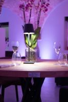 a table with three wine glasses and a vase with flowers at Moliké country house in Giulianova