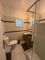 a bathroom with a toilet and a sink and a shower at Appartement Biot Village in Biot