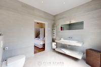 a bathroom with a sink and a mirror at Villa La Roche aux Mouettes FSHH in Nice