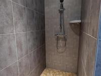 a shower with a shower head in a bathroom at Gîte Cherves-Richemont, 3 pièces, 5 personnes - FR-1-653-205 in Cherves-de-Cognac