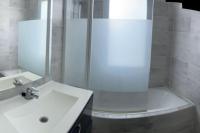 a bathroom with a shower and a white sink at Villa 200m2, 3 suites, patio avec salle jeux, 1 piscine CHAUFFE DE DEBUT AVRIL A FIN OCTOBRE in Maruéjols