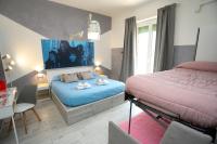 Posteľ alebo postele v izbe v ubytovaní Cineroma Guesthouse
