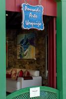 a sign that reads pomatal in a store at Pousada Arte Urquijo in Paraty