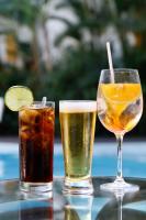two glasses of drinks sitting on a table at Pousada Arte Urquijo in Paraty