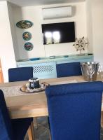 A television and/or entertainment centre at VILLA VITTORIA with PRIVATE HEATED SWIMMING POOL COMPLETE WITH HIDROMASSAGE FOR EXCLUSIVE USE , SEA VIEW, 150 METERS FROM THE BEACH