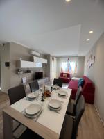 A seating area at Blue Moon - Via Parigi Apartments