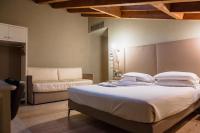 Posteľ alebo postele v izbe v ubytovaní Le Greghe Suites