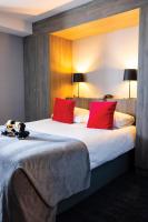 Ένα ή περισσότερα κρεβάτια σε δωμάτιο στο Van der Valk Hotel Liège Congres