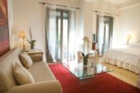 A bed or beds in a room at Milano Suites