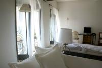 A bed or beds in a room at Milano Suites