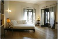 A bed or beds in a room at Milano Suites