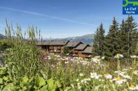 a field of flowers in front of a lodge at Résidence Pierre &amp; Vacances Premium Les Alpages de Chantel in Arc 1800