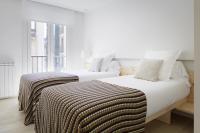 Łóżko lub łóżka w pokoju w obiekcie Santa Maria by FeelFree Rentals