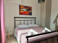 A bed or beds in a room at Lime House Corfu