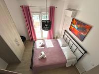 A bed or beds in a room at Lime House Corfu