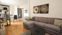 a living room with a couch and a table at Residence Pasteur Angouleme in Angoulême