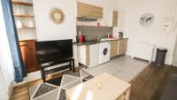 a kitchen with a washer and dryer in a room at Residence Pasteur Angouleme in Angoulême